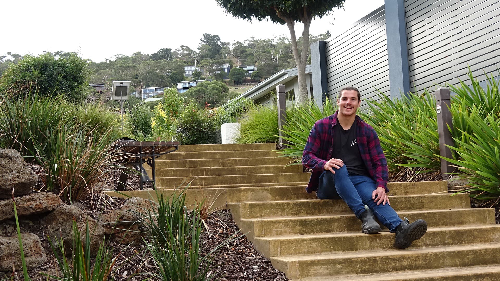 Sam Lylak seated outdoors