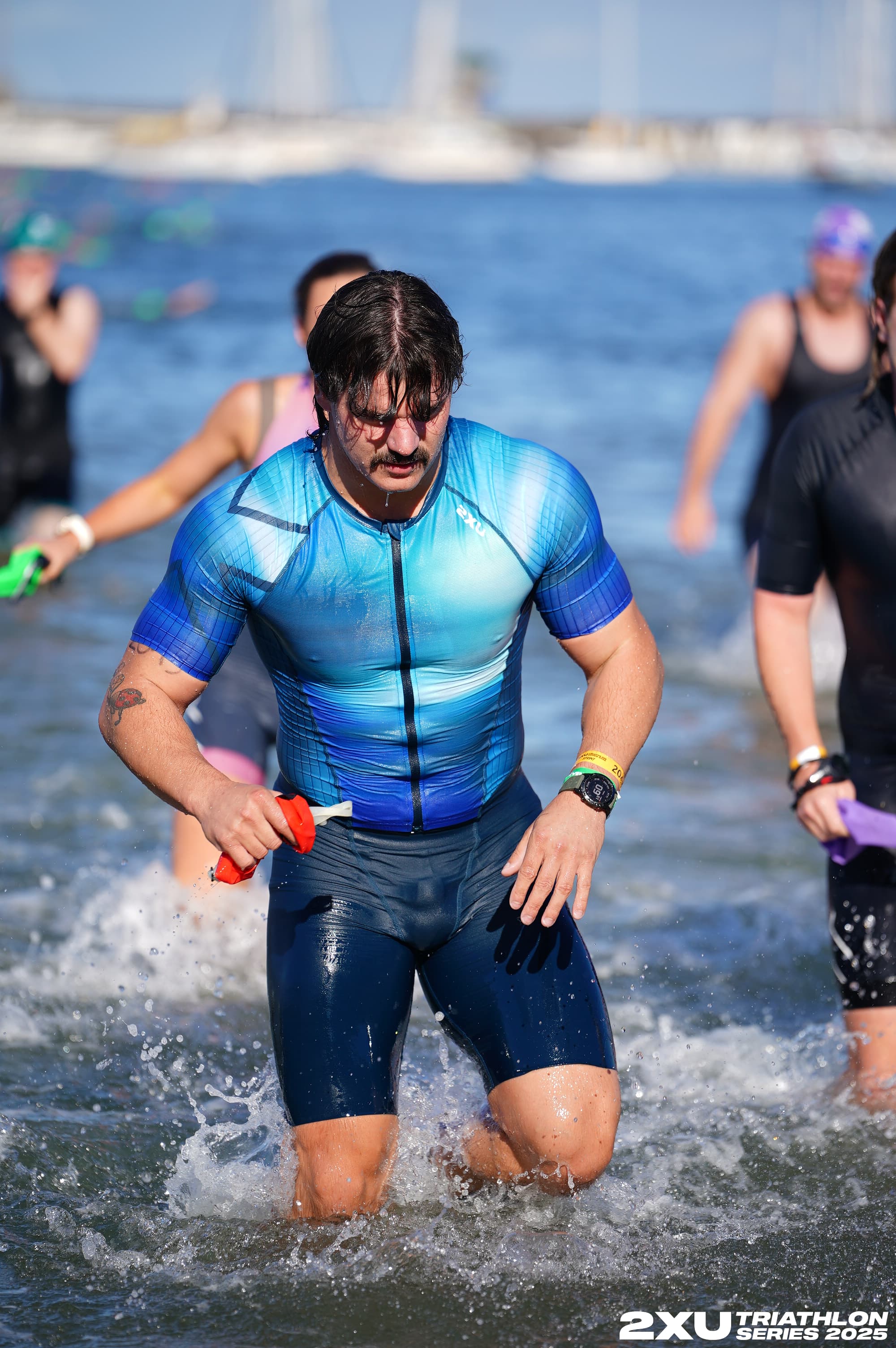 Sam emerging from the water during his first triathlon