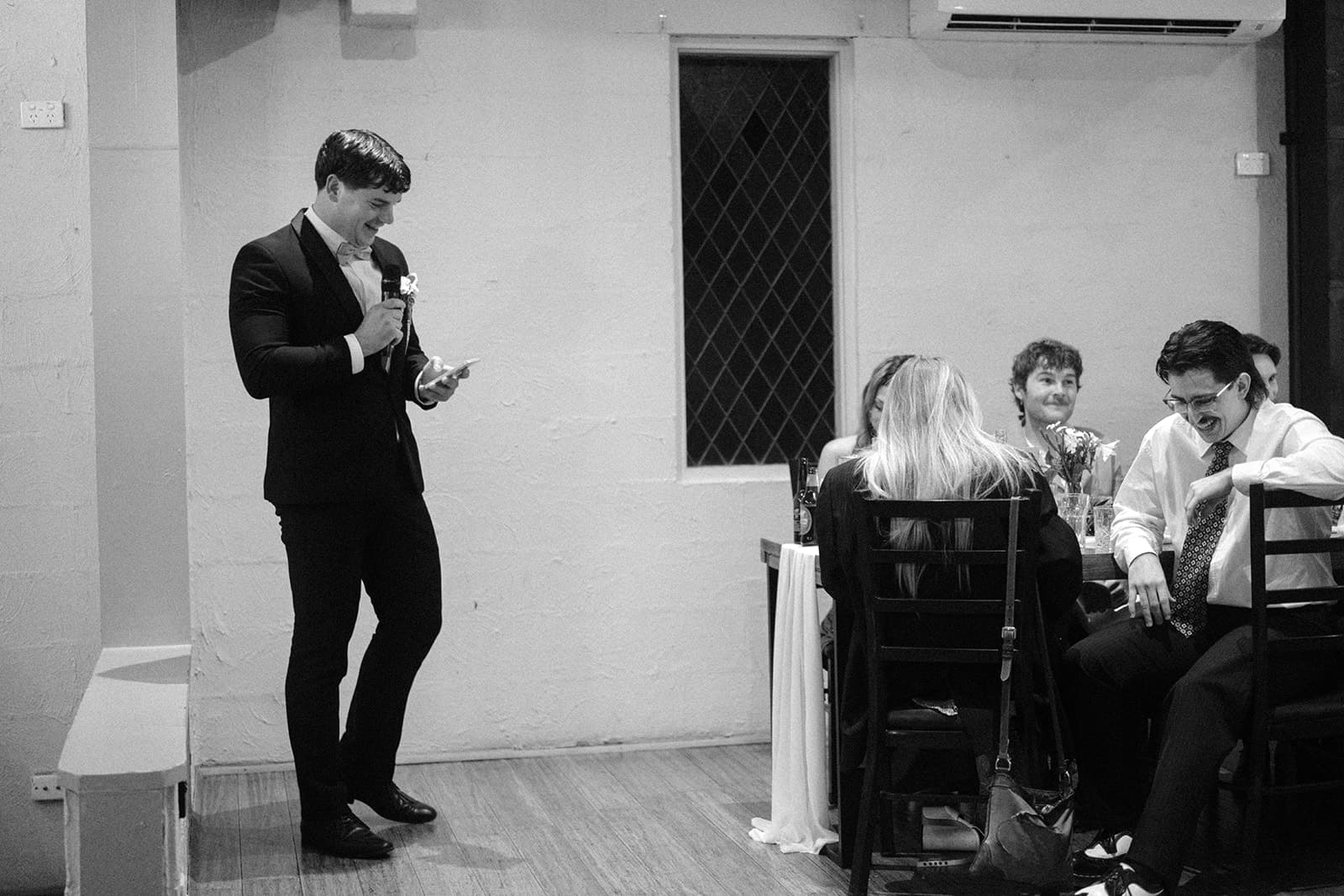Sam speaking to a room of people